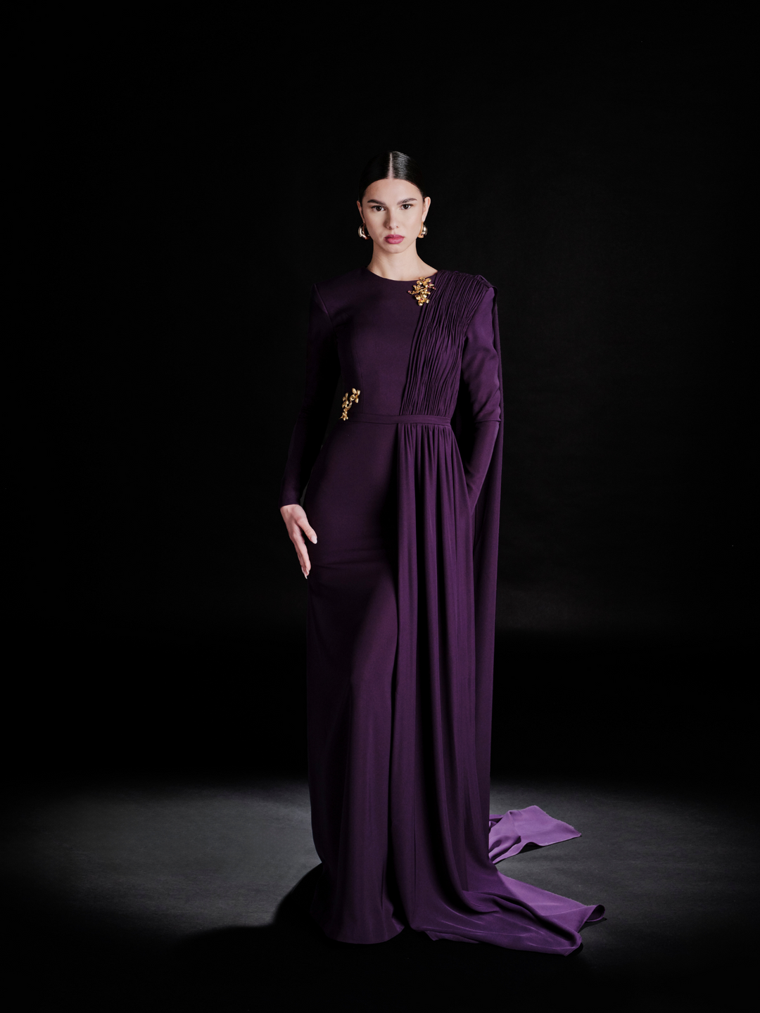 Look 31 – Regal Purple Draped Gown with Gold Embellishments